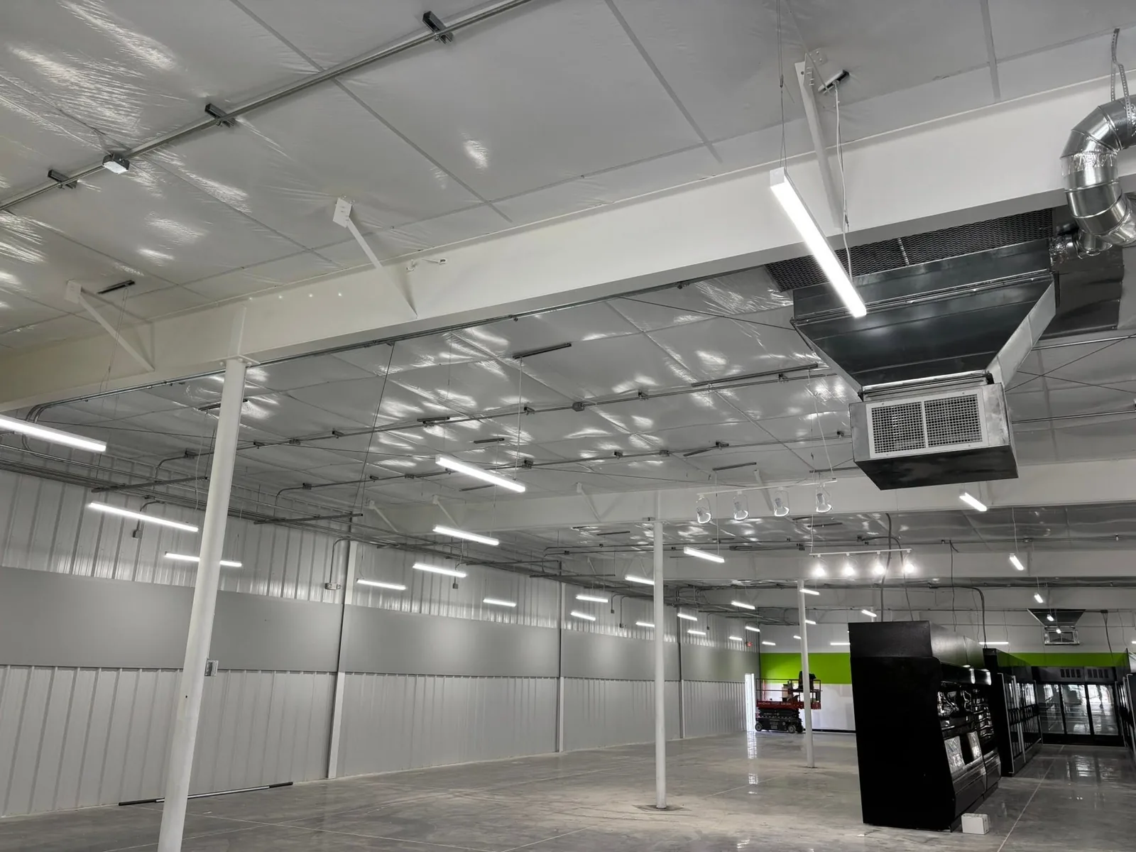New HVAC ductwork installed in a metal building interior